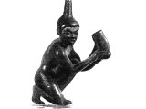 This bronze statuette shows a Negro houseboy cleaning one of his master`s boots - the `calceus`, which was worn only out-of-doors.